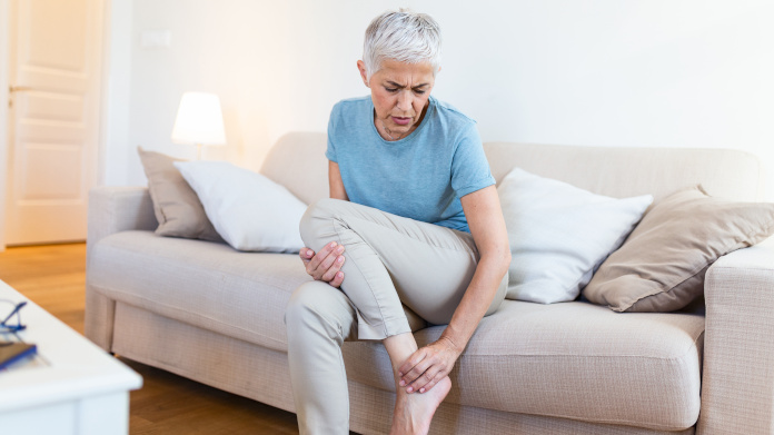 Elderly woman suffering from osteoporosis