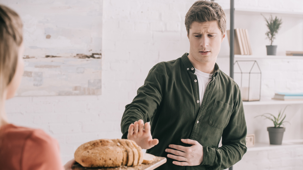 A gluten-sensitive person refusing bread